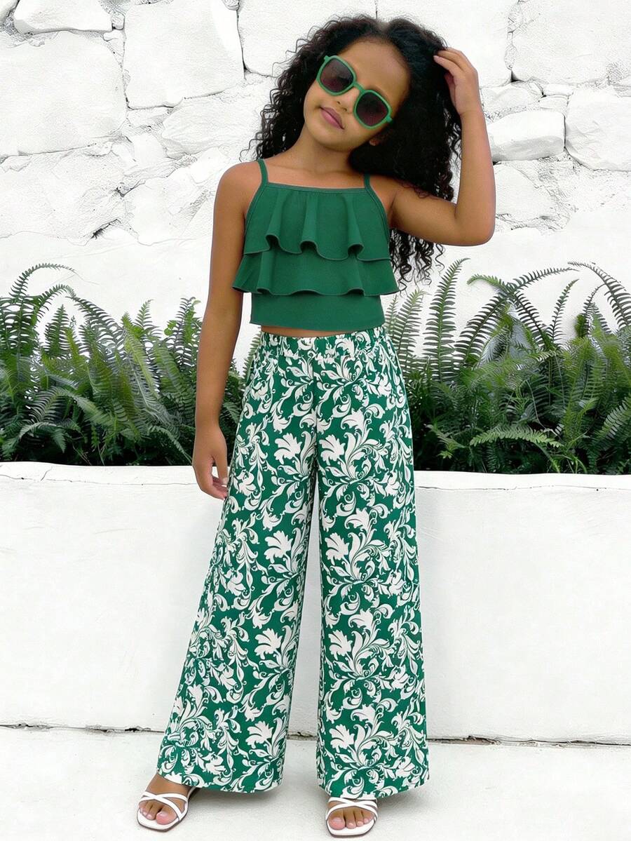 Tween girls blue 2-piece vacation outfit set featuring a tiered ruffle spaghetti strap camisole and loose high-waist pants.
