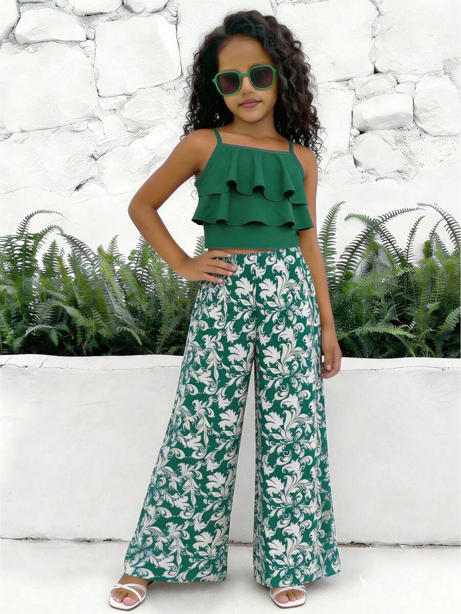Tween girls blue 2-piece vacation outfit set featuring a tiered ruffle spaghetti strap camisole and loose high-waist pants.