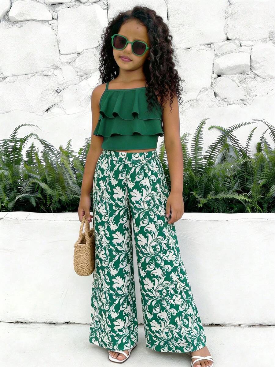 Tween girls blue 2-piece vacation outfit set featuring a tiered ruffle spaghetti strap camisole and loose high-waist pants.