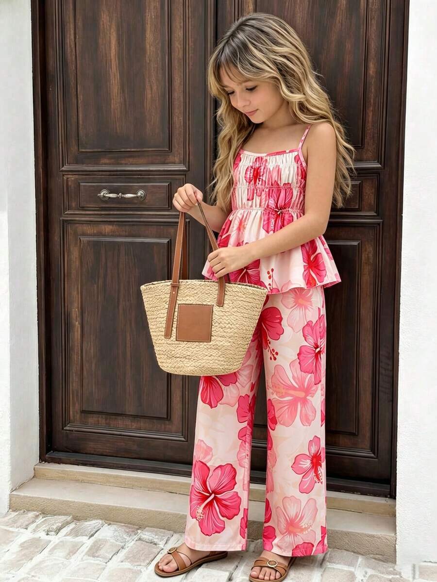 Tween girl wearing an apricot 2-piece outfit set featuring a shirred spaghetti strap short cami top and matching wide-leg long pants.