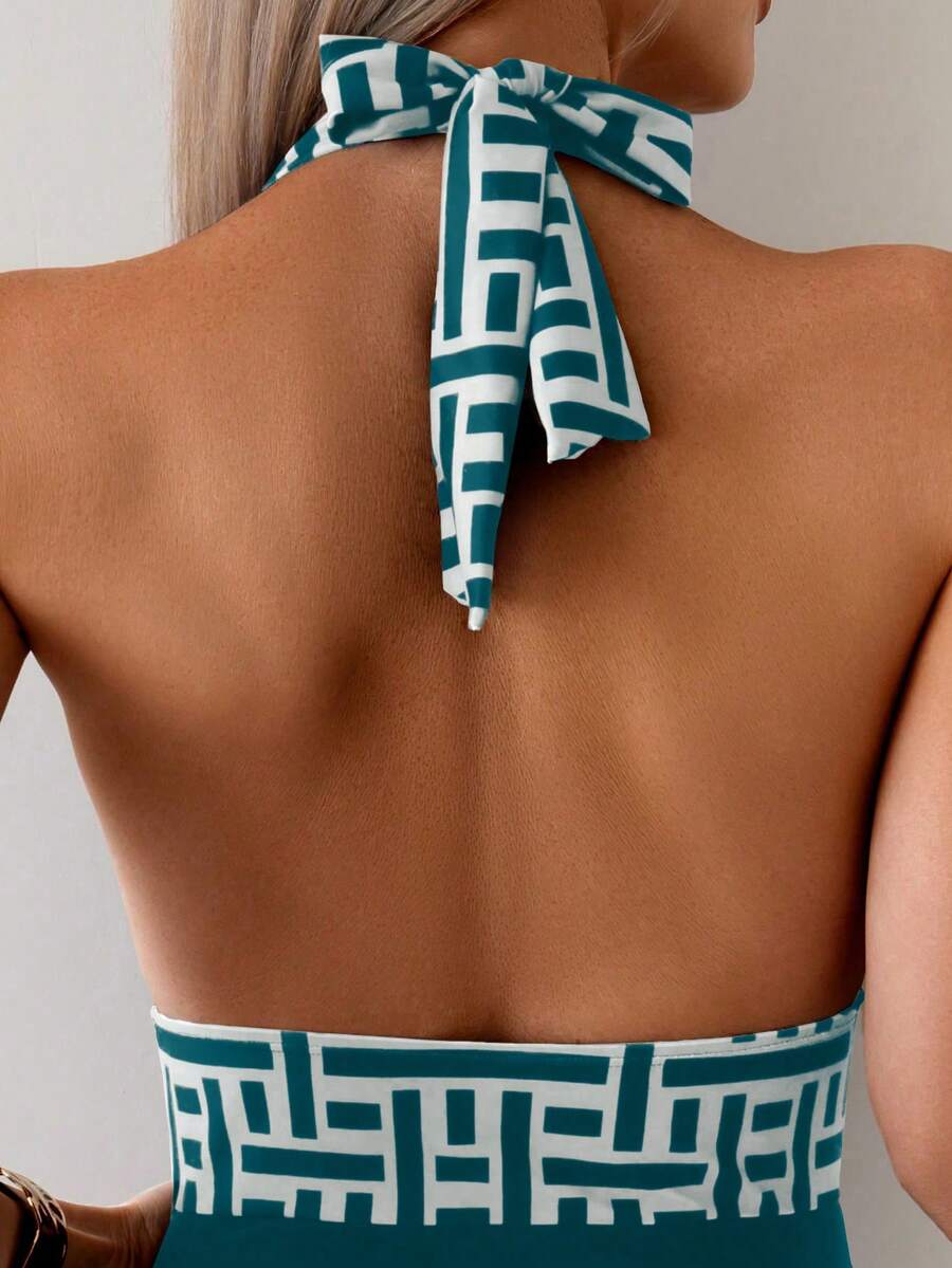 Apricot women's one-piece swimsuit featuring a halter neckline, backless tie-back detail, and ruched knitted fabric.