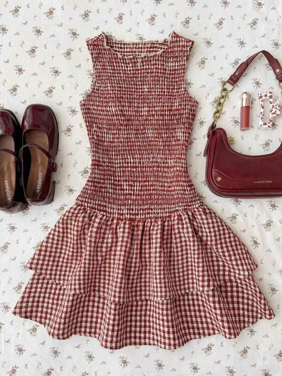 Tween girls sleeveless A-line mini dress in red and white plant pattern featuring round neck, high waist with ruffle and button details, and flounce hem.