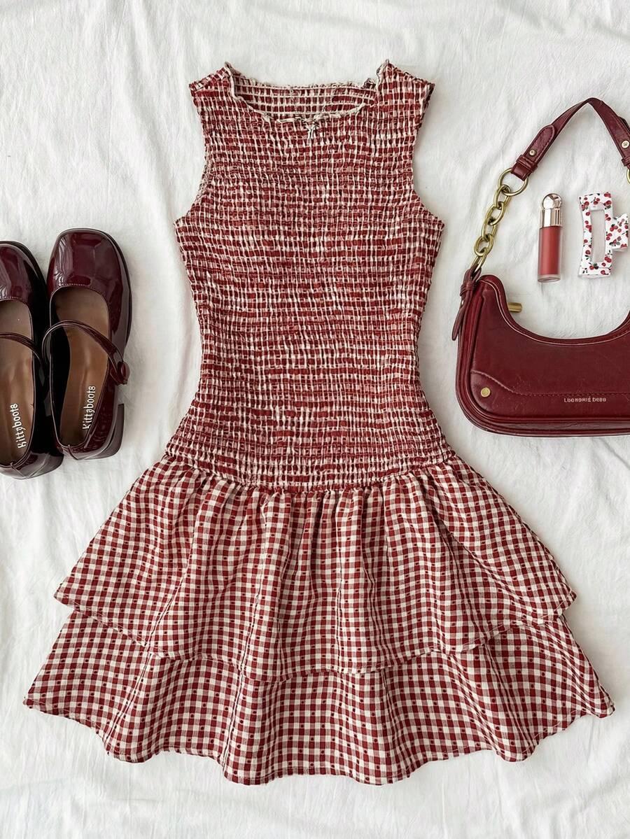 Tween girls sleeveless A-line mini dress in red and white plant pattern featuring round neck, high waist with ruffle and button details, and flounce hem.