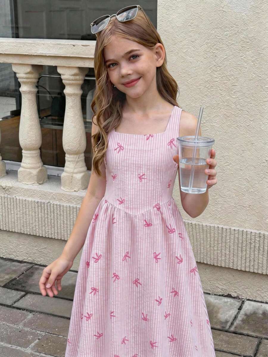 Tween girls pink floral sleeveless A-line midi dress featuring round neck, high waist with belt, contrast lace, and zipper back.
