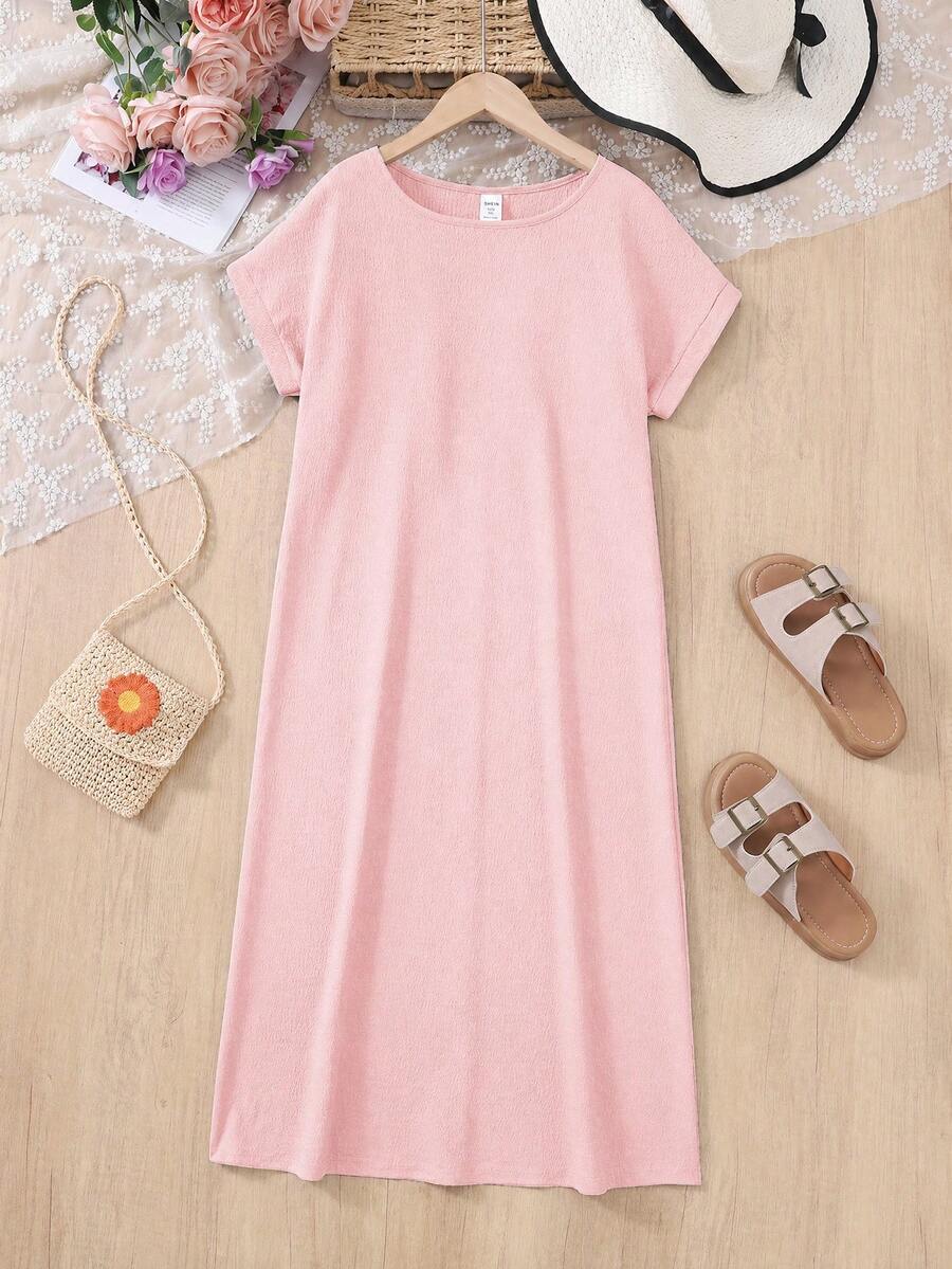 Tween girls casual black A-line long dress featuring short sleeves, a round neckline, and a decorative front bow with contrast lace trim.