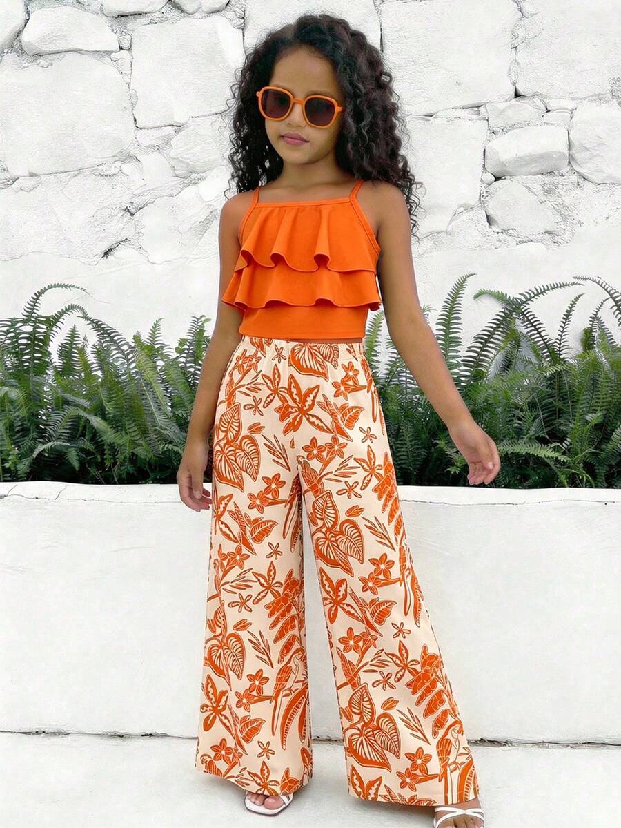 Tween girls blue 2-piece vacation outfit set featuring a tiered ruffle spaghetti strap camisole and loose high-waist pants.