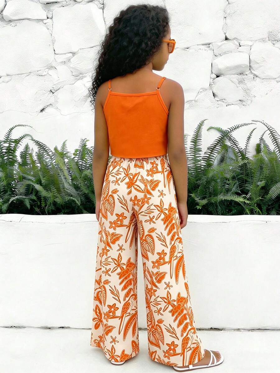 Tween girls blue 2-piece vacation outfit set featuring a tiered ruffle spaghetti strap camisole and loose high-waist pants.