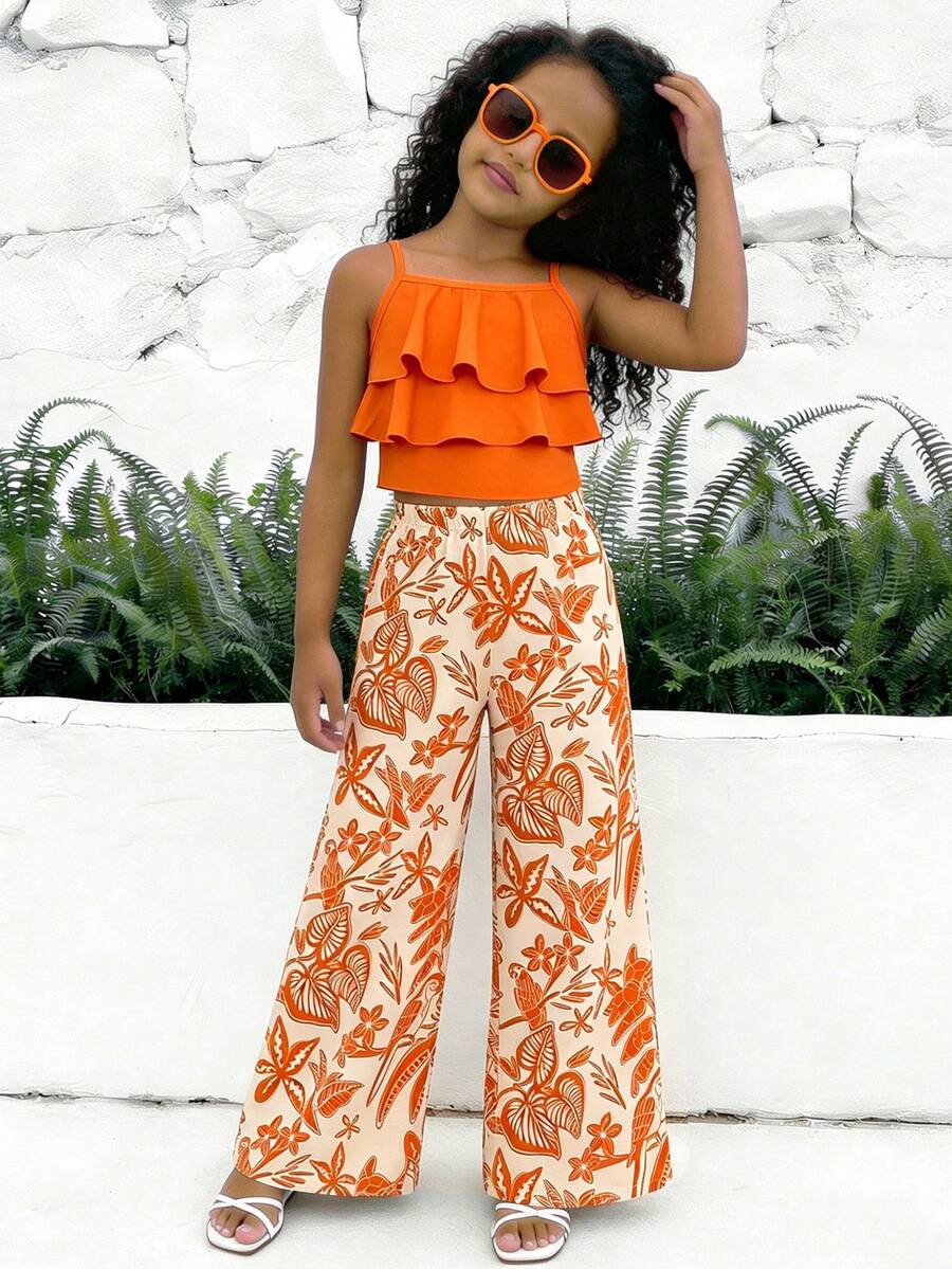 Tween girls blue 2-piece vacation outfit set featuring a tiered ruffle spaghetti strap camisole and loose high-waist pants.