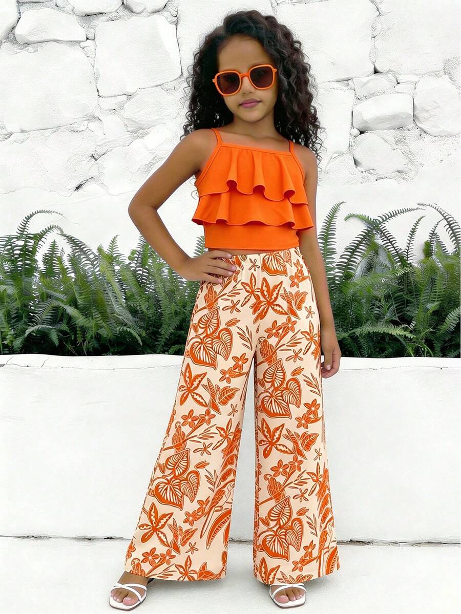 Tween girls blue 2-piece vacation outfit set featuring a tiered ruffle spaghetti strap camisole and loose high-waist pants.