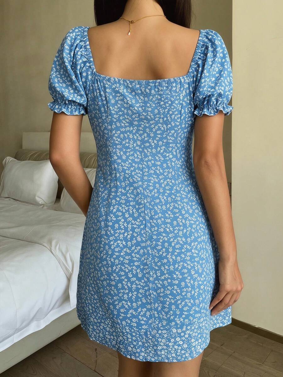 Black floral all-over print midi dress for tween girls featuring puff half sleeves, spaghetti strap neckline, and an A-line silhouette.