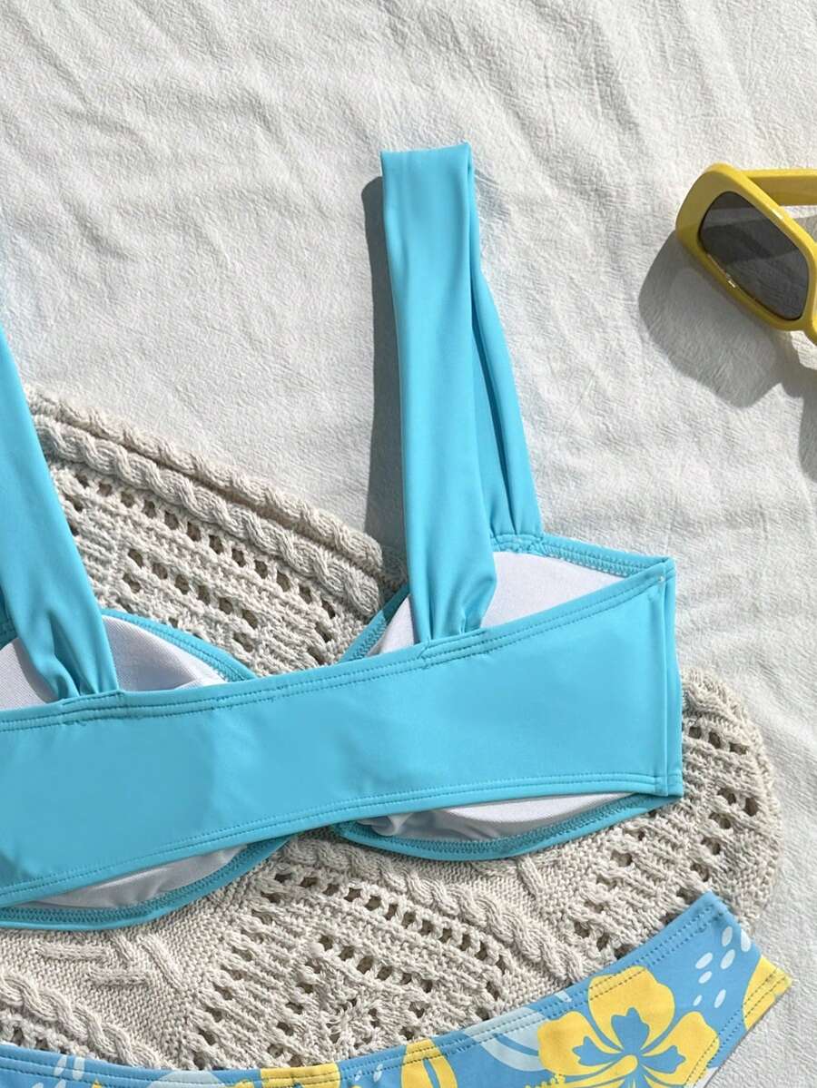 Baby blue floral print bikini set with ring strap detail and matching bikini bottoms.