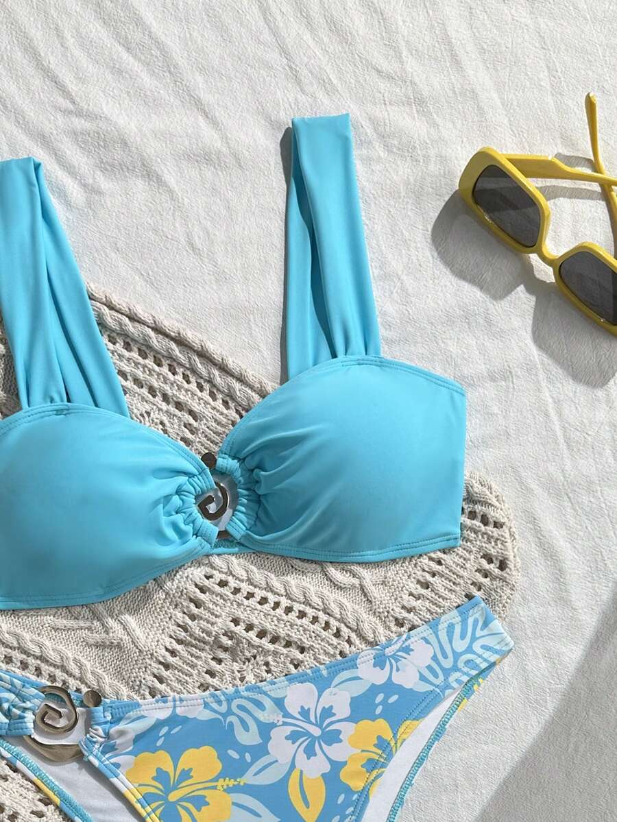 Baby blue floral print bikini set with ring strap detail and matching bikini bottoms.