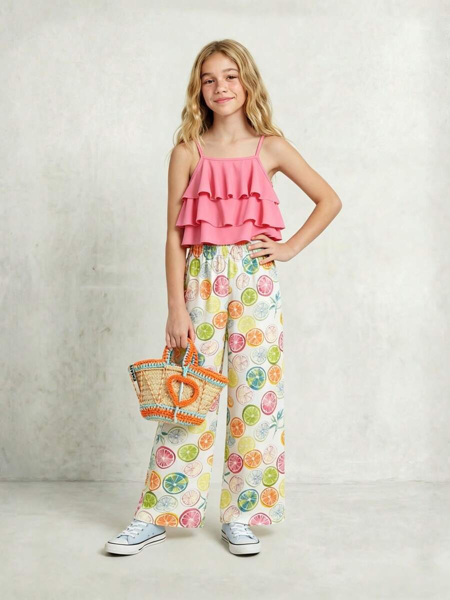 Tween girls blue 2-piece vacation outfit set featuring a tiered ruffle spaghetti strap camisole and loose high-waist pants.