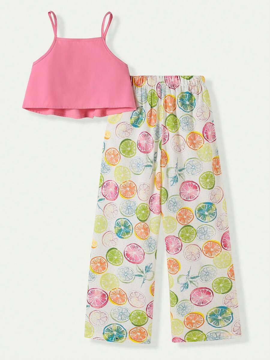 Tween girls blue 2-piece vacation outfit set featuring a tiered ruffle spaghetti strap camisole and loose high-waist pants.