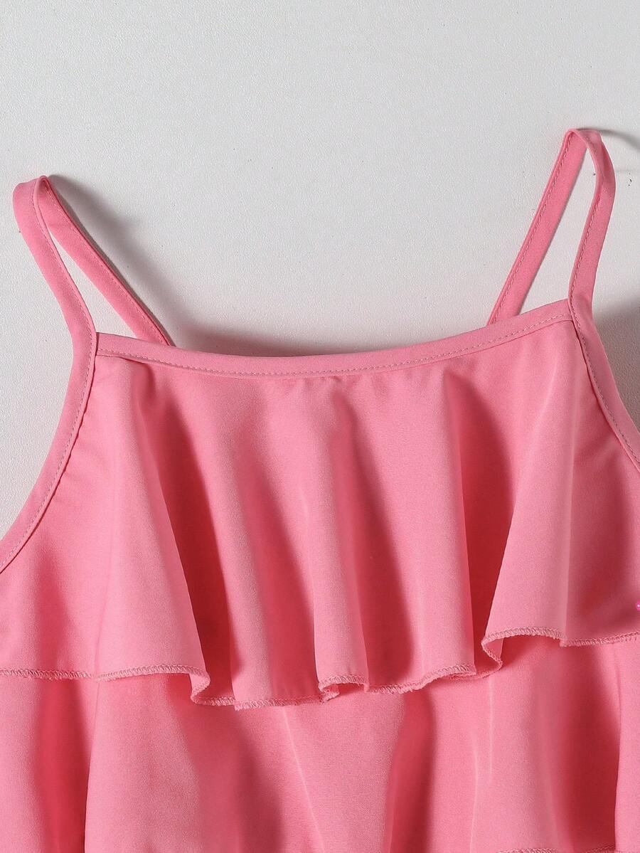 Tween girls blue 2-piece vacation outfit set featuring a tiered ruffle spaghetti strap camisole and loose high-waist pants.