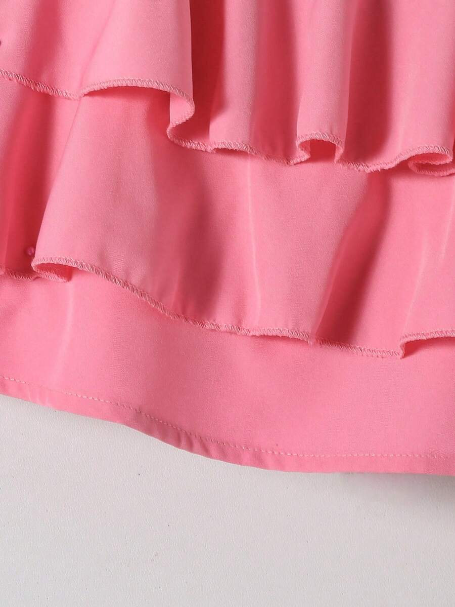 Tween girls blue 2-piece vacation outfit set featuring a tiered ruffle spaghetti strap camisole and loose high-waist pants.
