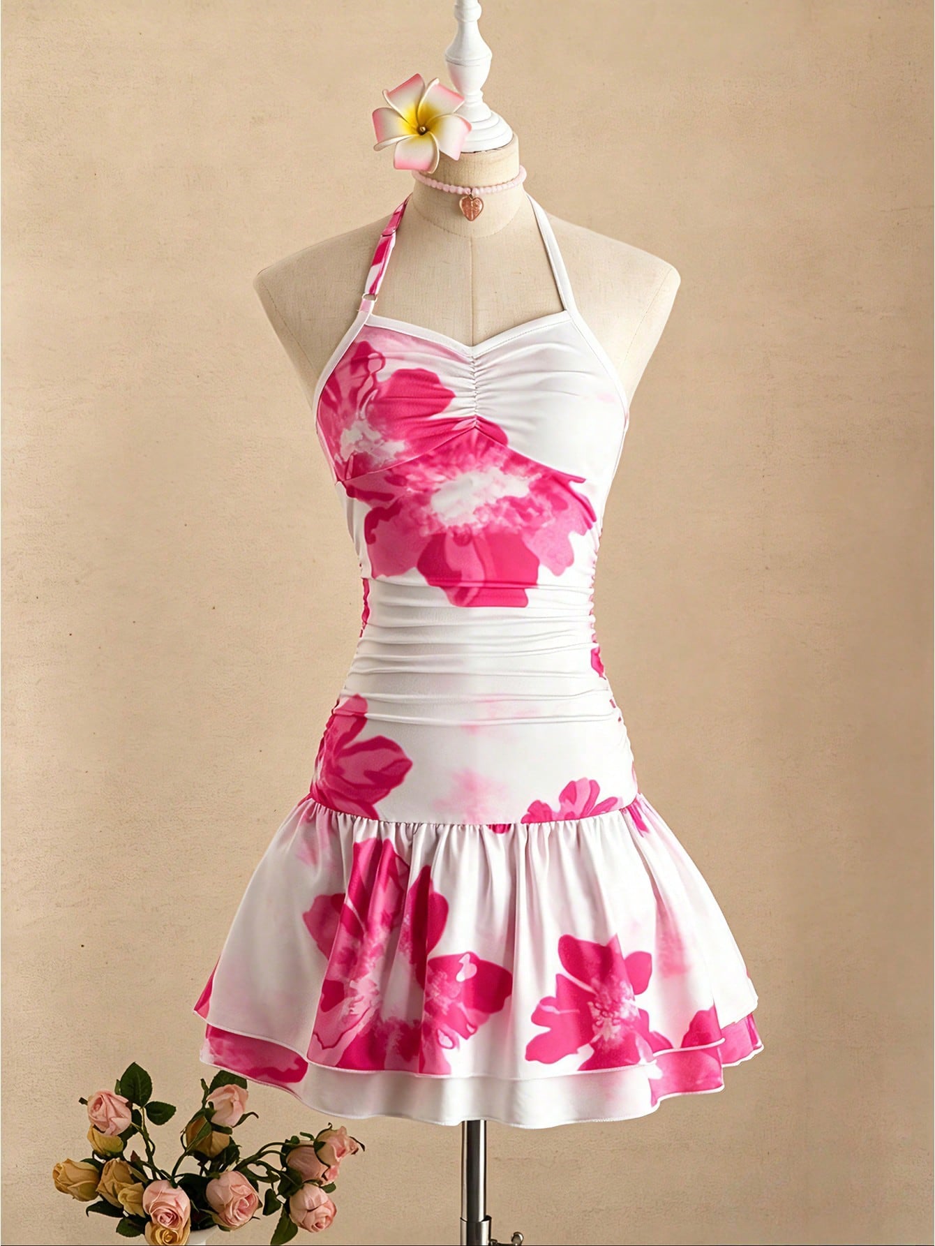 Tween girl black mini dress with halter neckline, backless design, tiered layer detail, high waist, flounce hem, and sleeveless slim fit.