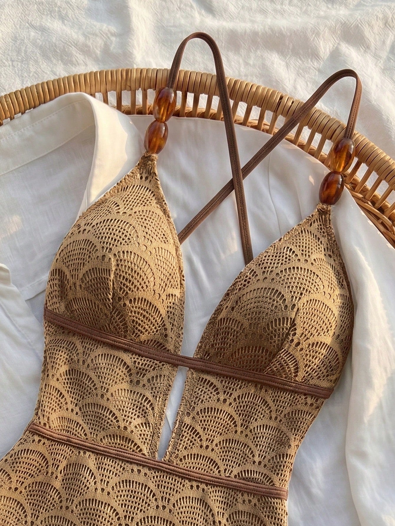 Women's fresh green boho one-piece swimsuit featuring a lace-up V-neckline, textured stretch fabric, and sleeveless design for beach and vacation wear.