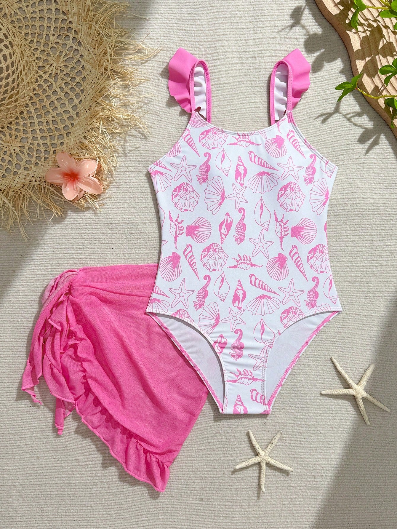 Tween girls one-piece swimsuit in leopard print with ruffle shoulder straps, scoop neckline, fitted shape, and attached ruffle hem skirt; sleeveless, mid-waist skirt bottom, and lined body for swimming, vacation, and summer beach wear.