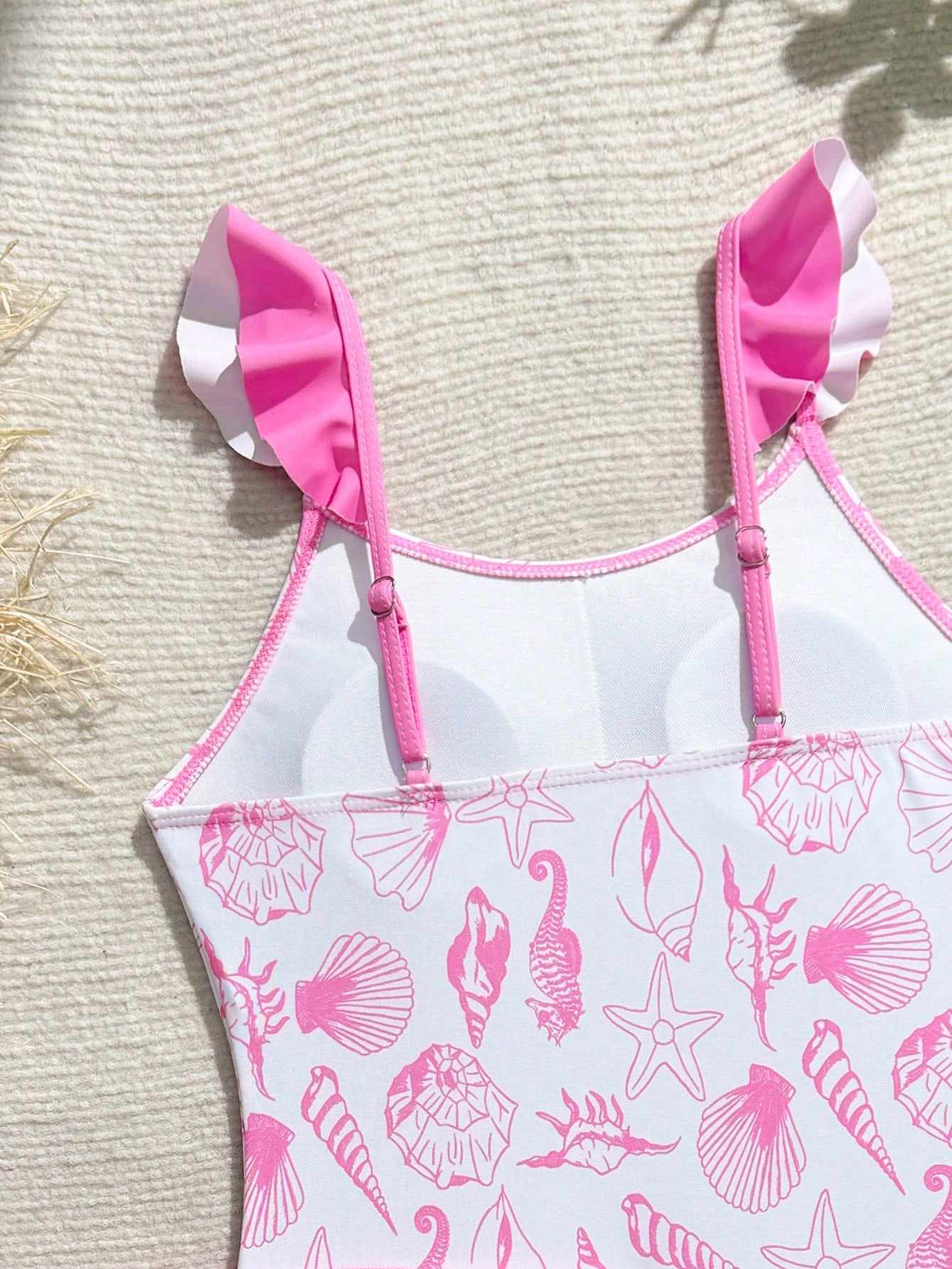 Tween girls one-piece swimsuit in leopard print with ruffle shoulder straps, scoop neckline, fitted shape, and attached ruffle hem skirt; sleeveless, mid-waist skirt bottom, and lined body for swimming, vacation, and summer beach wear.