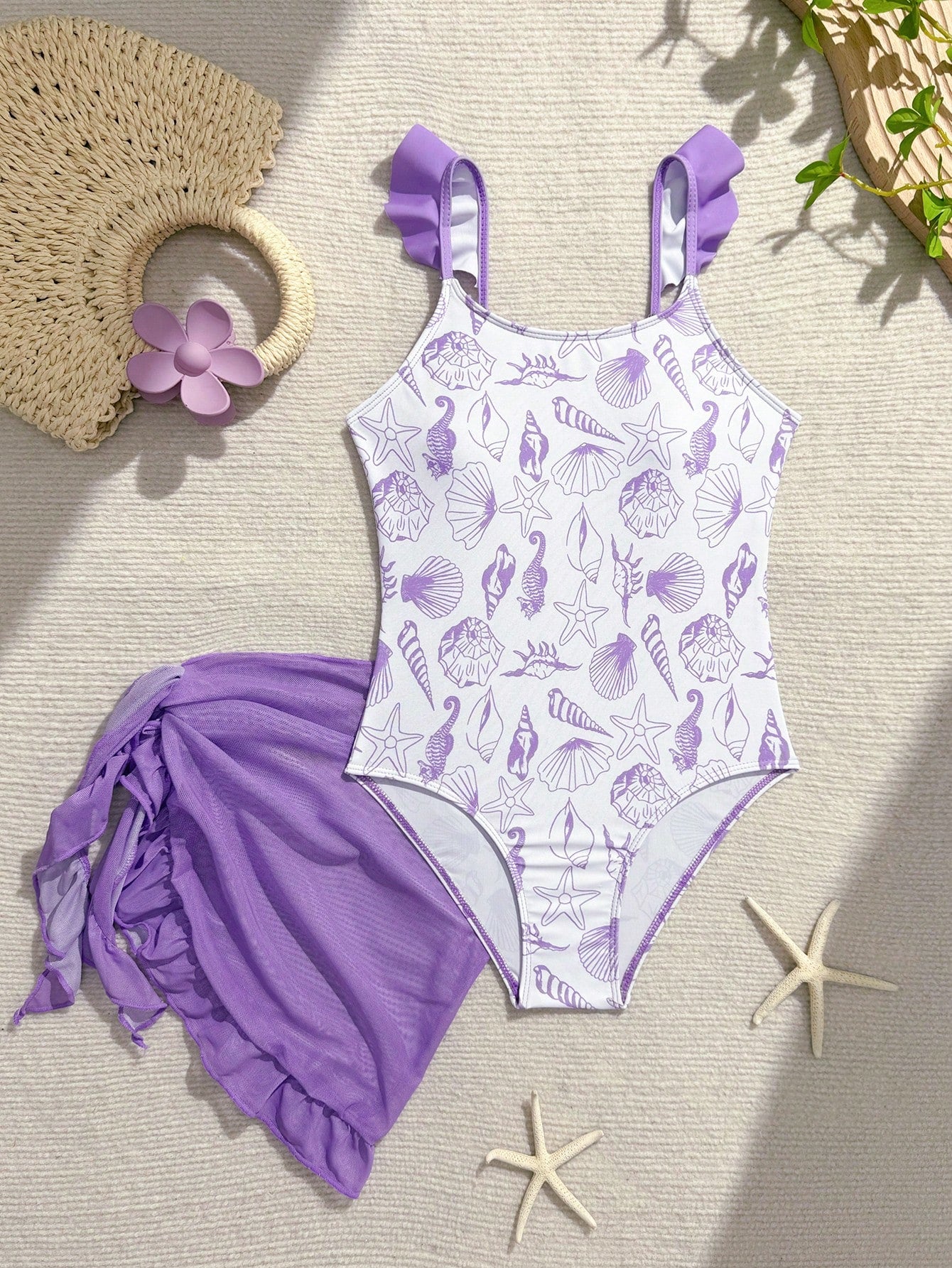 Tween girls one-piece swimsuit in leopard print with ruffle shoulder straps, scoop neckline, fitted shape, and attached ruffle hem skirt; sleeveless, mid-waist skirt bottom, and lined body for swimming, vacation, and summer beach wear.