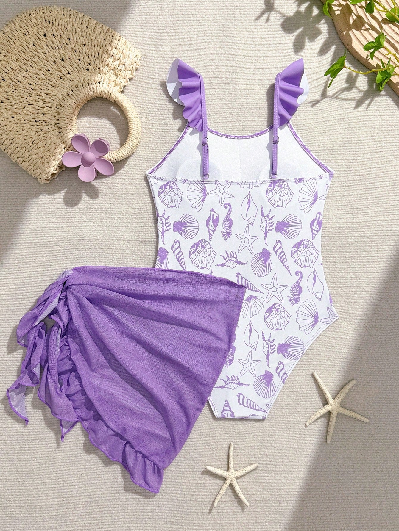 Tween girls one-piece swimsuit in leopard print with ruffle shoulder straps, scoop neckline, fitted shape, and attached ruffle hem skirt; sleeveless, mid-waist skirt bottom, and lined body for swimming, vacation, and summer beach wear.