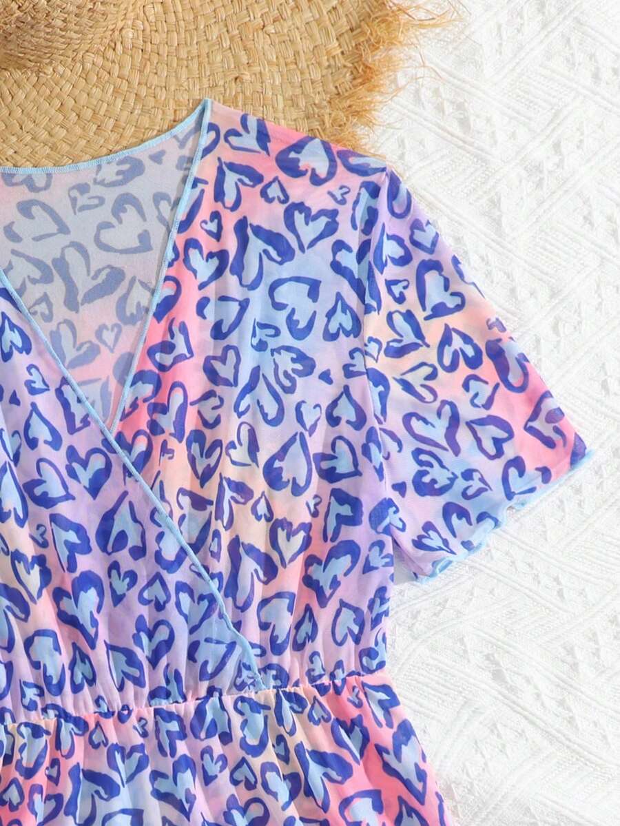 Multicolor heart print long cover up dress for tween girls featuring a V-neck criss-cross wrap front and short sleeves.