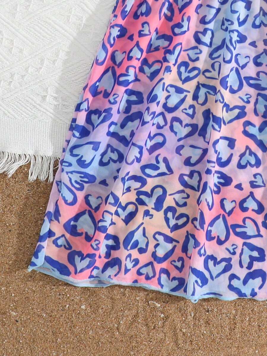 Multicolor heart print long cover up dress for tween girls featuring a V-neck criss-cross wrap front and short sleeves.