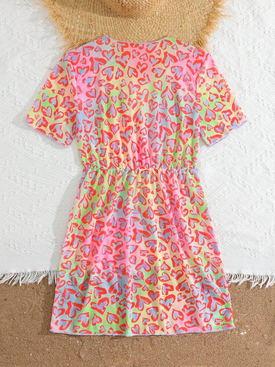 Multicolor heart print long cover up dress for tween girls featuring a V-neck criss-cross wrap front and short sleeves.