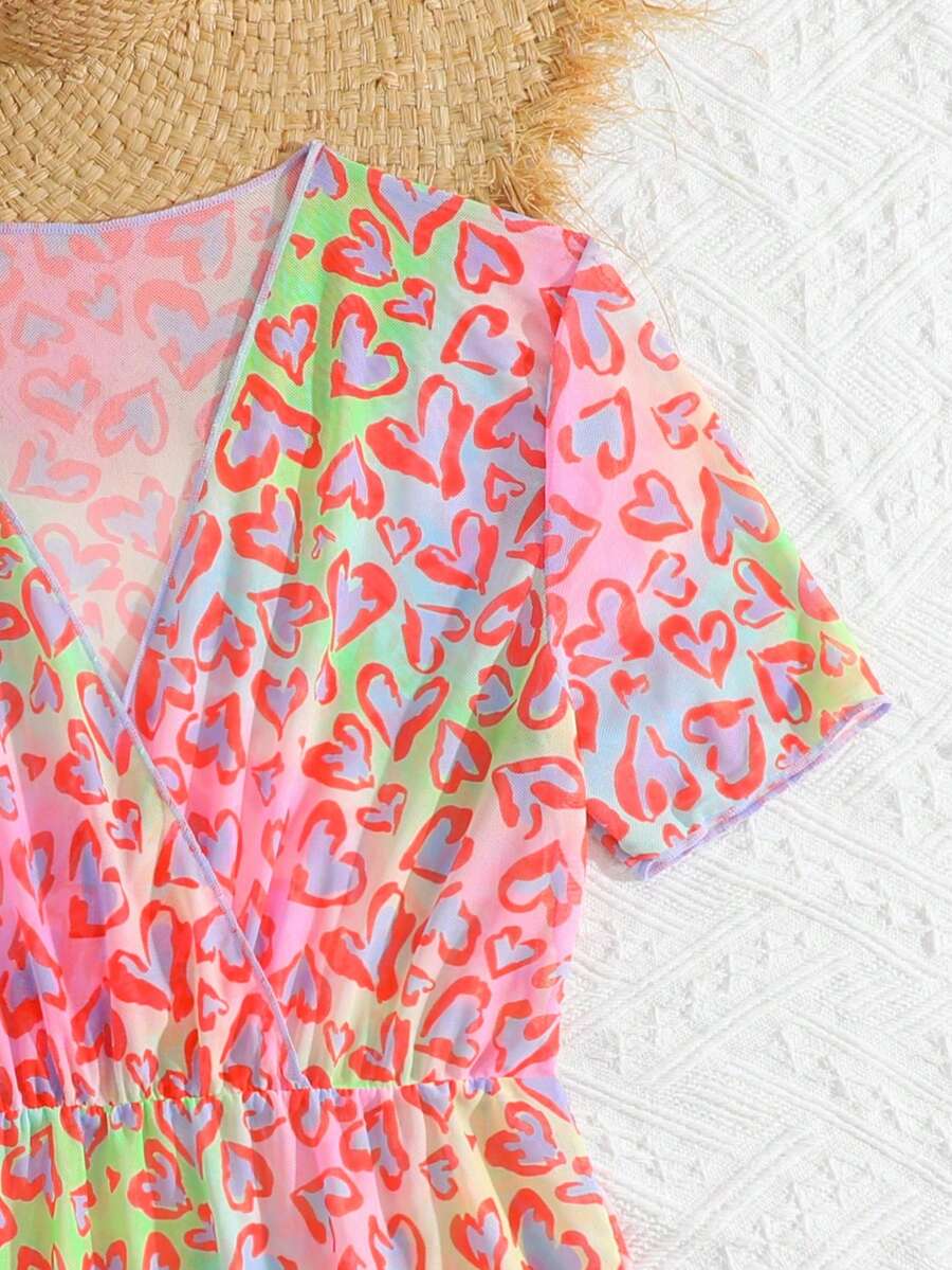 Multicolor heart print long cover up dress for tween girls featuring a V-neck criss-cross wrap front and short sleeves.