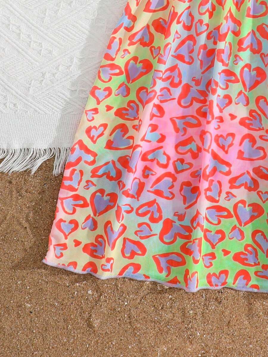 Multicolor heart print long cover up dress for tween girls featuring a V-neck criss-cross wrap front and short sleeves.