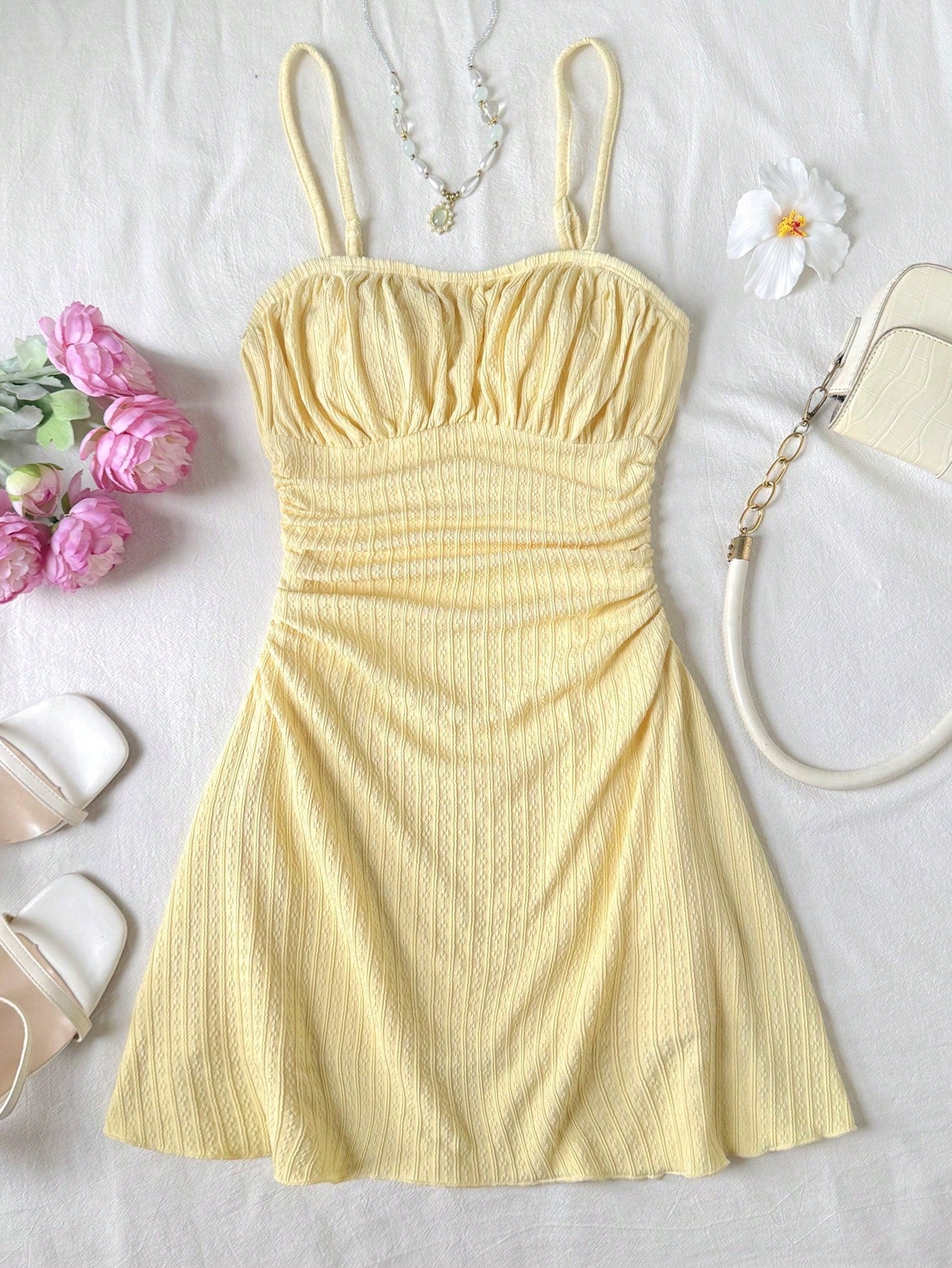 Apricot tween girls sleeveless halter cami dress with appliques, bow front, zipper detail, high waist, flared hem, and short slim fit design.