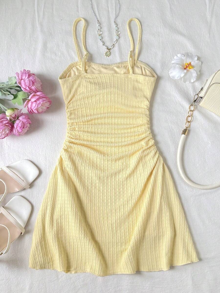 Tween girls blue sleeveless cami dress with spaghetti straps, ruched bust, short slim fit, and vacation-ready style
