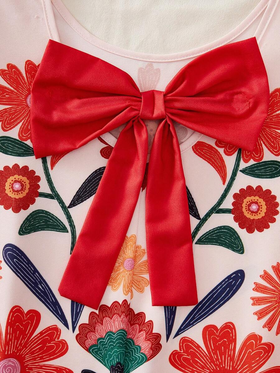 Tween girls apricot vacation midi dress featuring a round neck, cut out details, ruffle flounce accents, and geometric pattern.