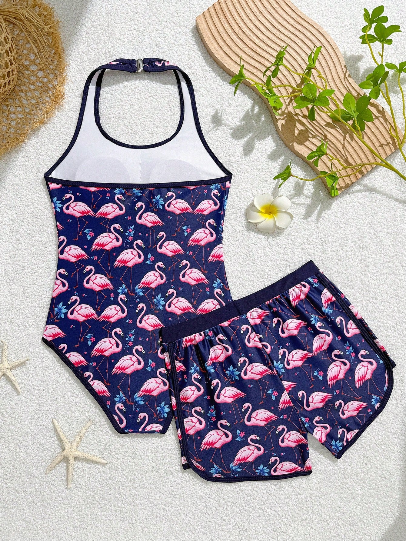 Girls 2-piece swimwear set featuring a butterfly print halter swimsuit top with contrast piping and separate mid-waist shorts; sleeveless, high-stretch, wireless design for beach and vacation wear.