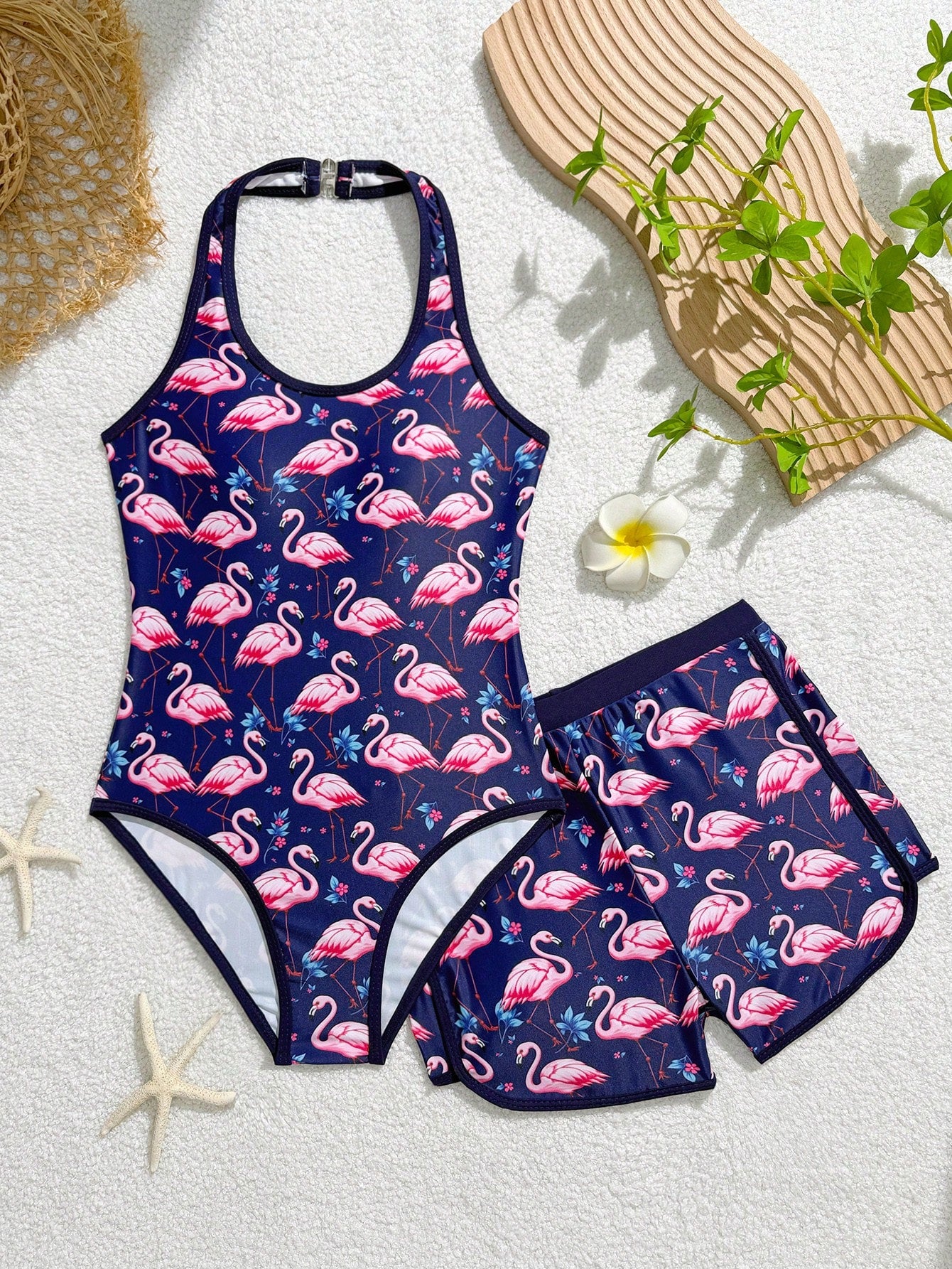 Girls 2-piece swimwear set featuring a butterfly print halter swimsuit top with contrast piping and separate mid-waist shorts; sleeveless, high-stretch, wireless design for beach and vacation wear.