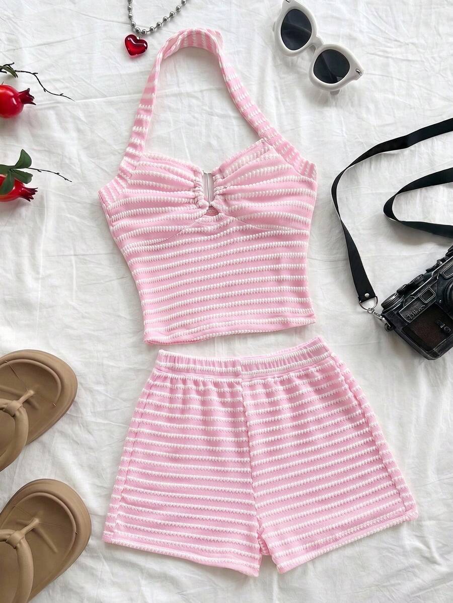 Tween girls black and white striped two-piece set featuring a spaghetti strap micro crop tank top with lettuce trim and ruffle hem paired with matching slim fit shorts.