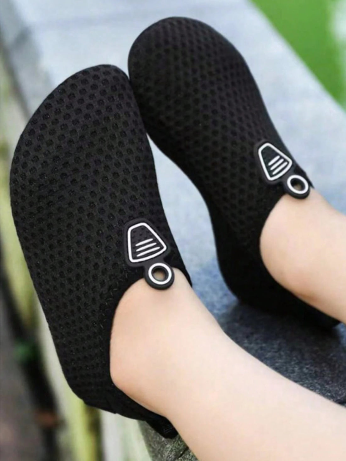 Kids black graphic water shoes with breathable Lycra upper, slip-on stretch design, and non-slip rubber outsole for boys and girls.