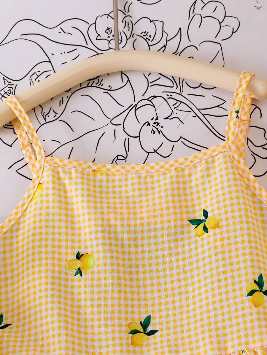 Tween girl wearing an apricot floral print sleeveless mini cami dress featuring spaghetti straps, a shirred high waist, flounce hem, and a bow back detail.