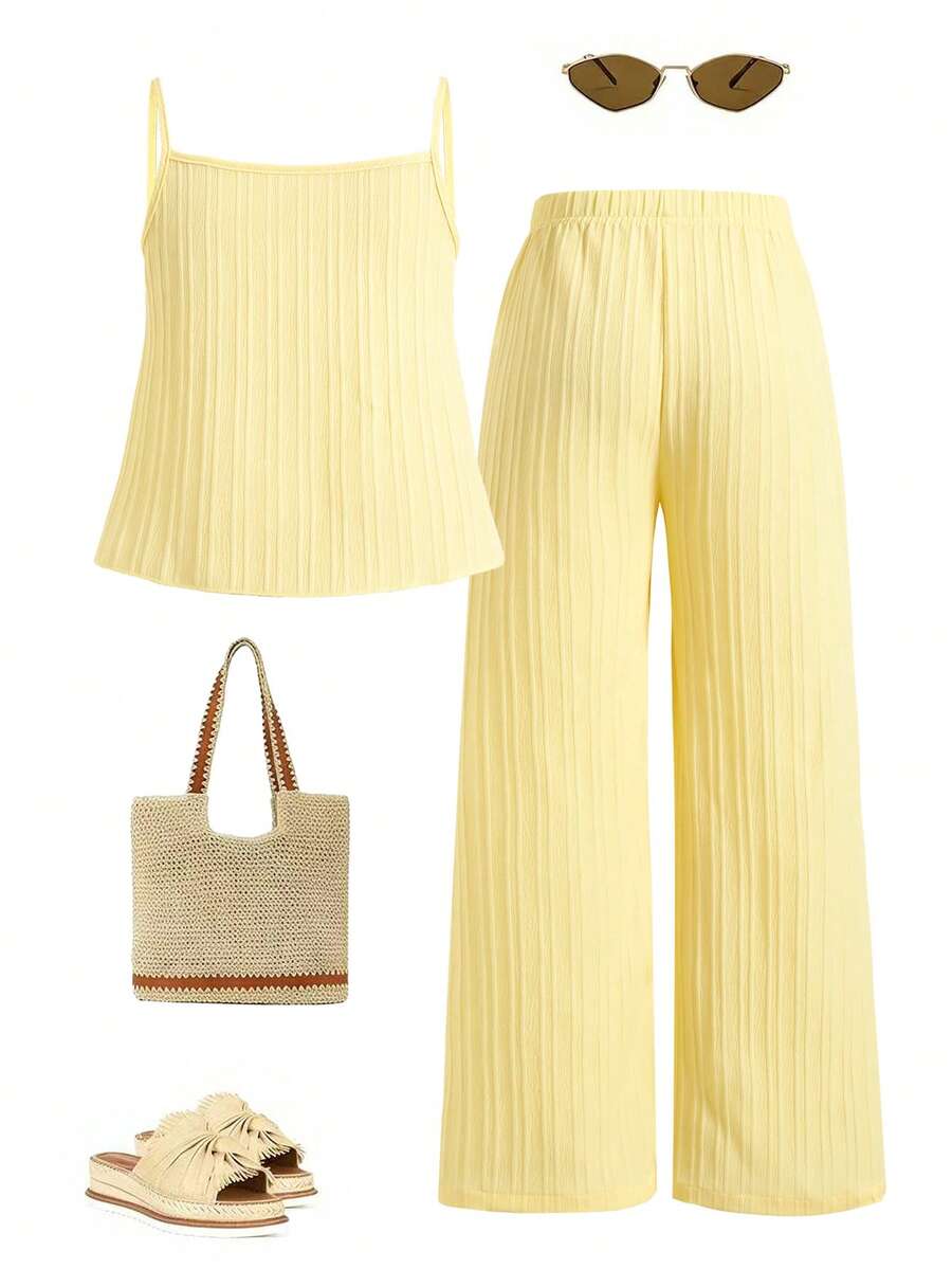 Tween girl wearing an apricot 2-piece outfit set featuring a shirred spaghetti strap short cami top and matching wide-leg long pants.