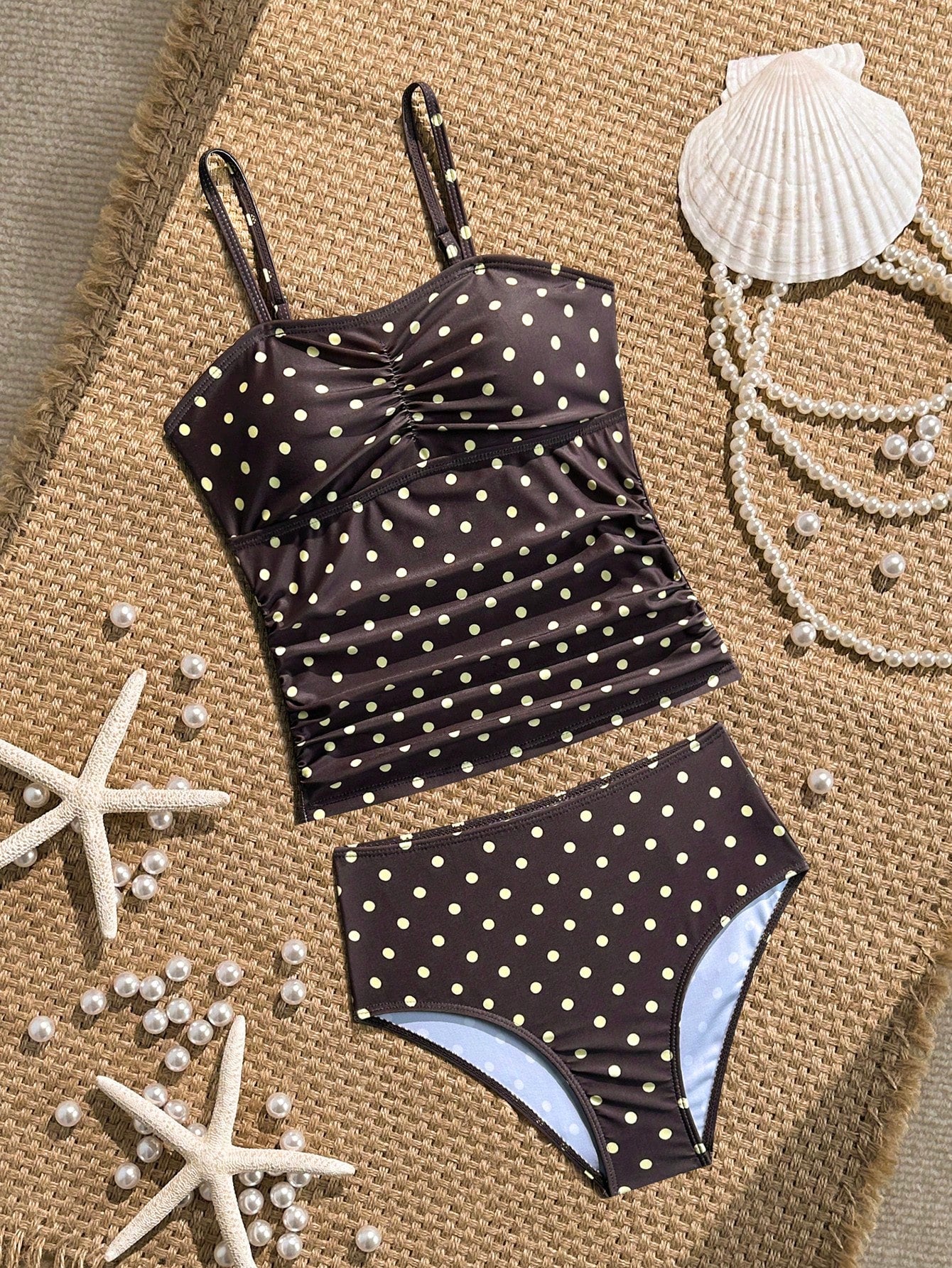 Tween girls 2-piece bikini swimwear set in black with a wave-pattern geometric design, featuring halter neckline, wireless top, and high-waist short bottoms with starfish and shell decor.