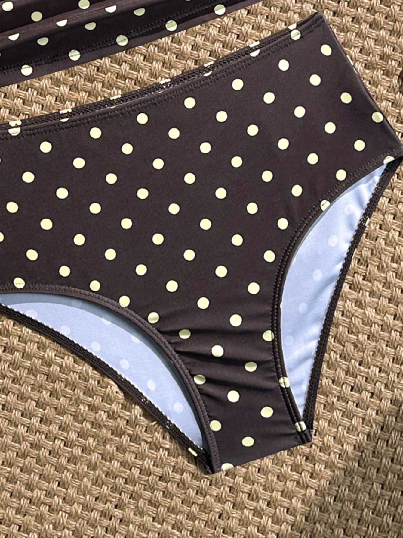 Tween girls 2-piece bikini swimwear set in black with a wave-pattern geometric design, featuring halter neckline, wireless top, and high-waist short bottoms with starfish and shell decor.
