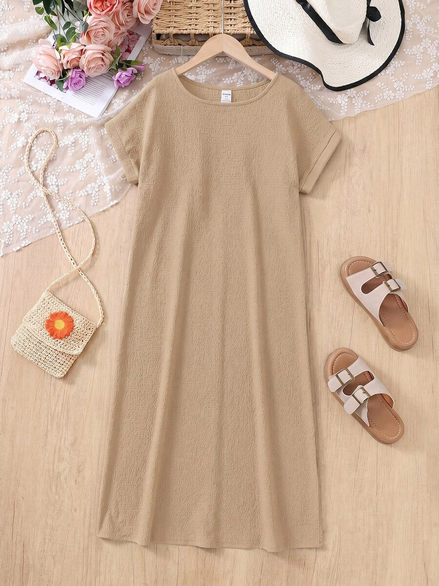 Tween girls casual black A-line long dress featuring short sleeves, a round neckline, and a decorative front bow with contrast lace trim.