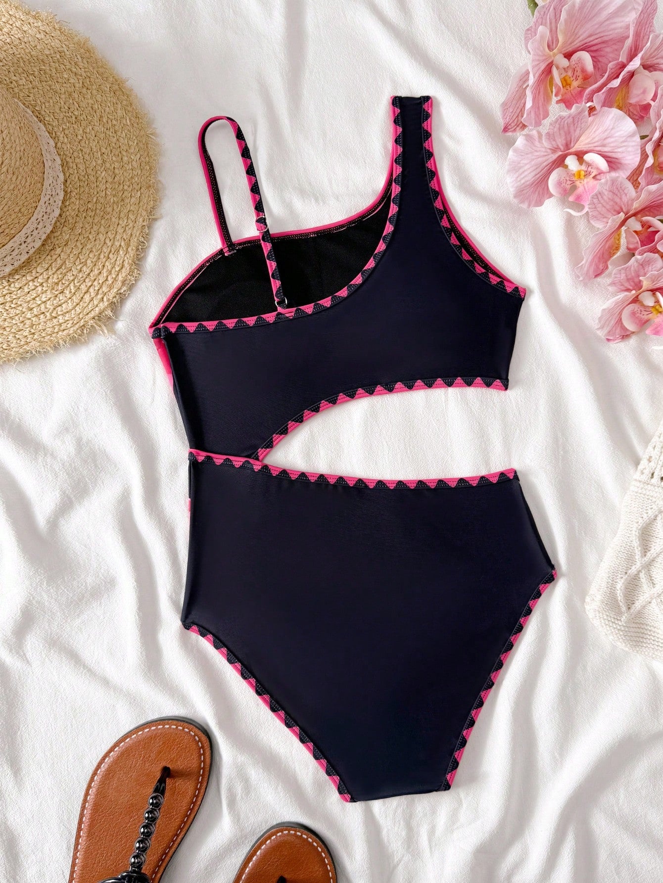 Tween girls one-piece swimsuit featuring an asymmetric neckline, pendant decor, plain design, wireless bra, high-cut bottom, and medium-stretch fabric.