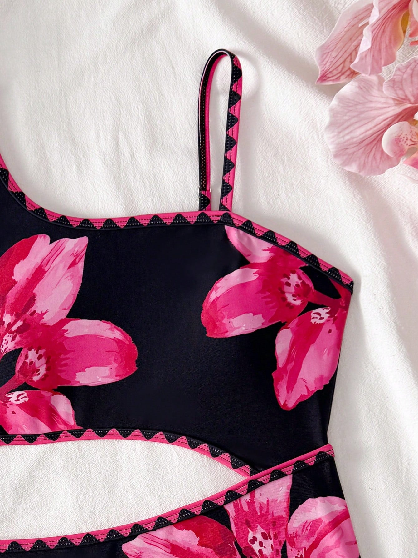 Tween girls one-piece swimsuit featuring an asymmetric neckline, pendant decor, plain design, wireless bra, high-cut bottom, and medium-stretch fabric.