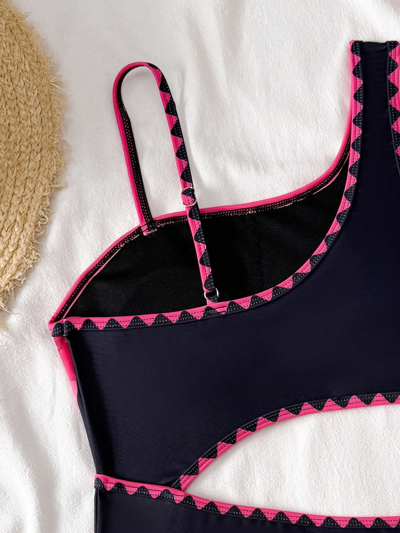 Tween girls one-piece swimsuit featuring an asymmetric neckline, pendant decor, plain design, wireless bra, high-cut bottom, and medium-stretch fabric.