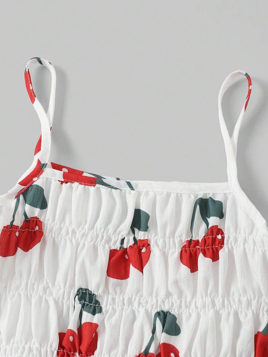 Girls 2-piece summer outfit set featuring a blue bow print camisole top with spaghetti straps and matching high-waisted straight leg pants.