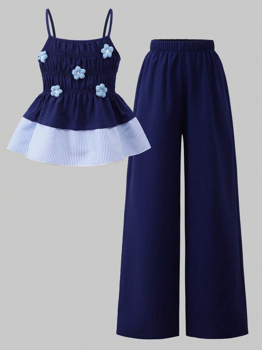 Girls 2-piece summer outfit set featuring a blue bow print camisole top with spaghetti straps and matching high-waisted straight leg pants.