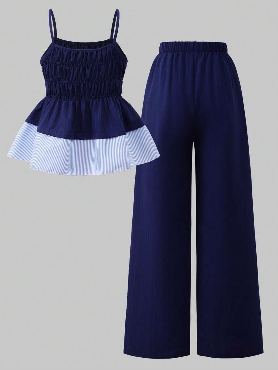 Girls 2-piece summer outfit set featuring a blue bow print camisole top with spaghetti straps and matching high-waisted straight leg pants.