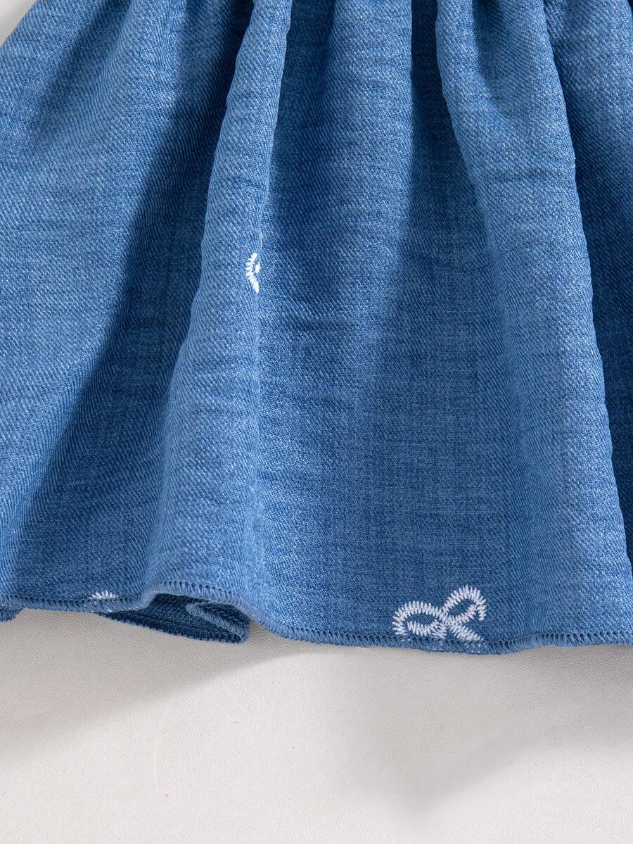 Girls 2-piece summer outfit set featuring a blue bow print camisole top with spaghetti straps and matching high-waisted straight leg pants.
